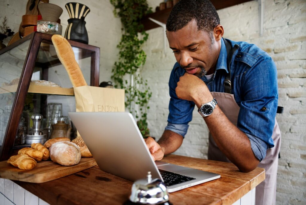 Business owner discussing a new website for Luton businesses with a digital specialist